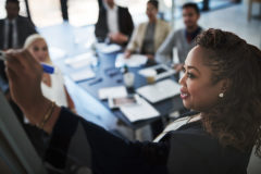 female founder writing on a board